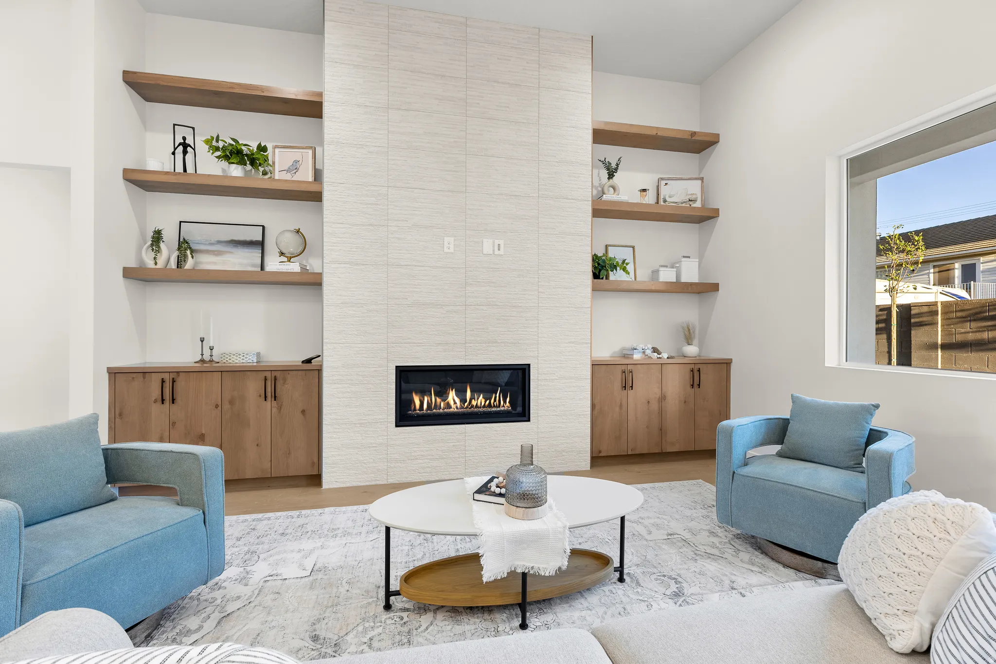 Living room with wood finished floors and a fireplace