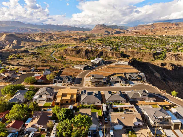 Aerial perspective of suburban area with a mountainous background