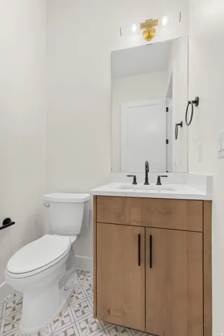 Half bath with vanity and toilet