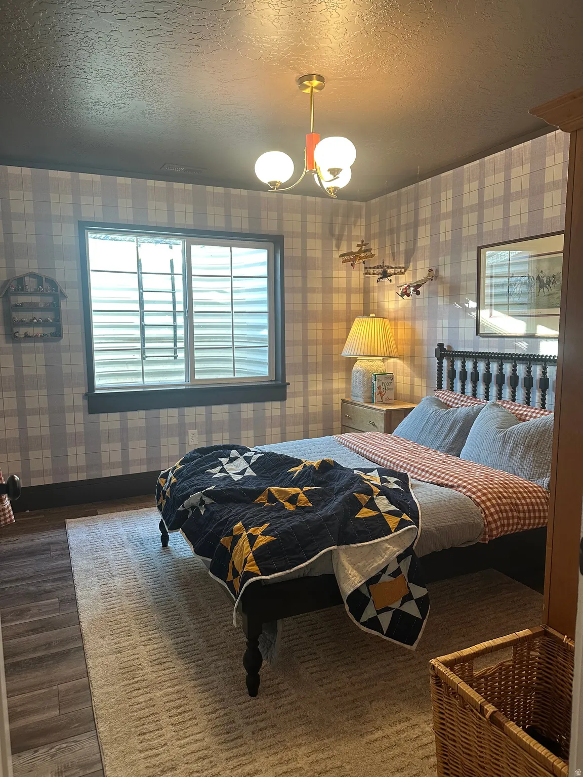 Window with white blinds, dark wood-finish flooring, and a ceiling-mounted light fixture