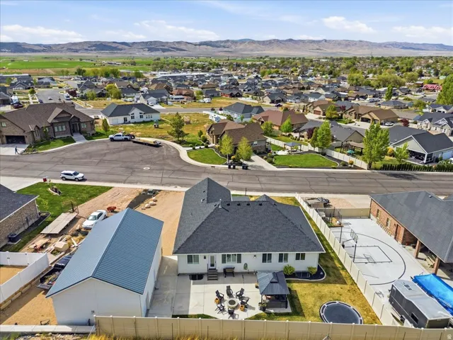 Aerial perspective of suburban area featuring a mountainous background