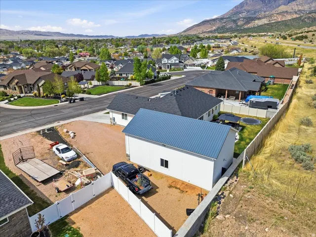 Aerial perspective of suburban area featuring a mountain backdrop