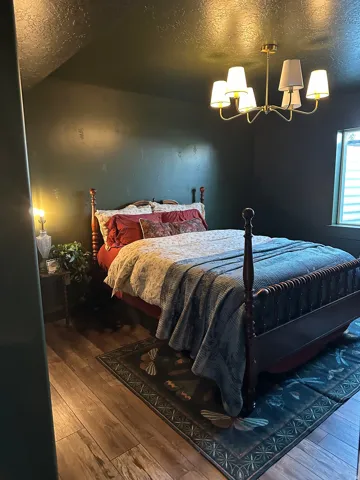 Wood-finish flooring with a dark accent wall