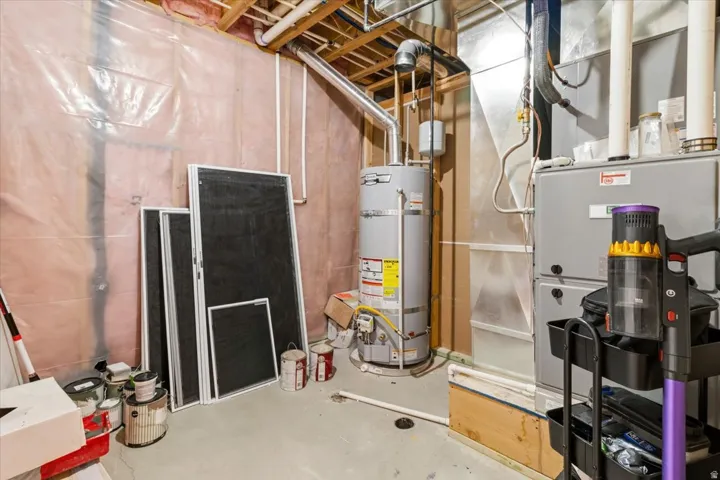 Utility room with heating unit and secured water heater