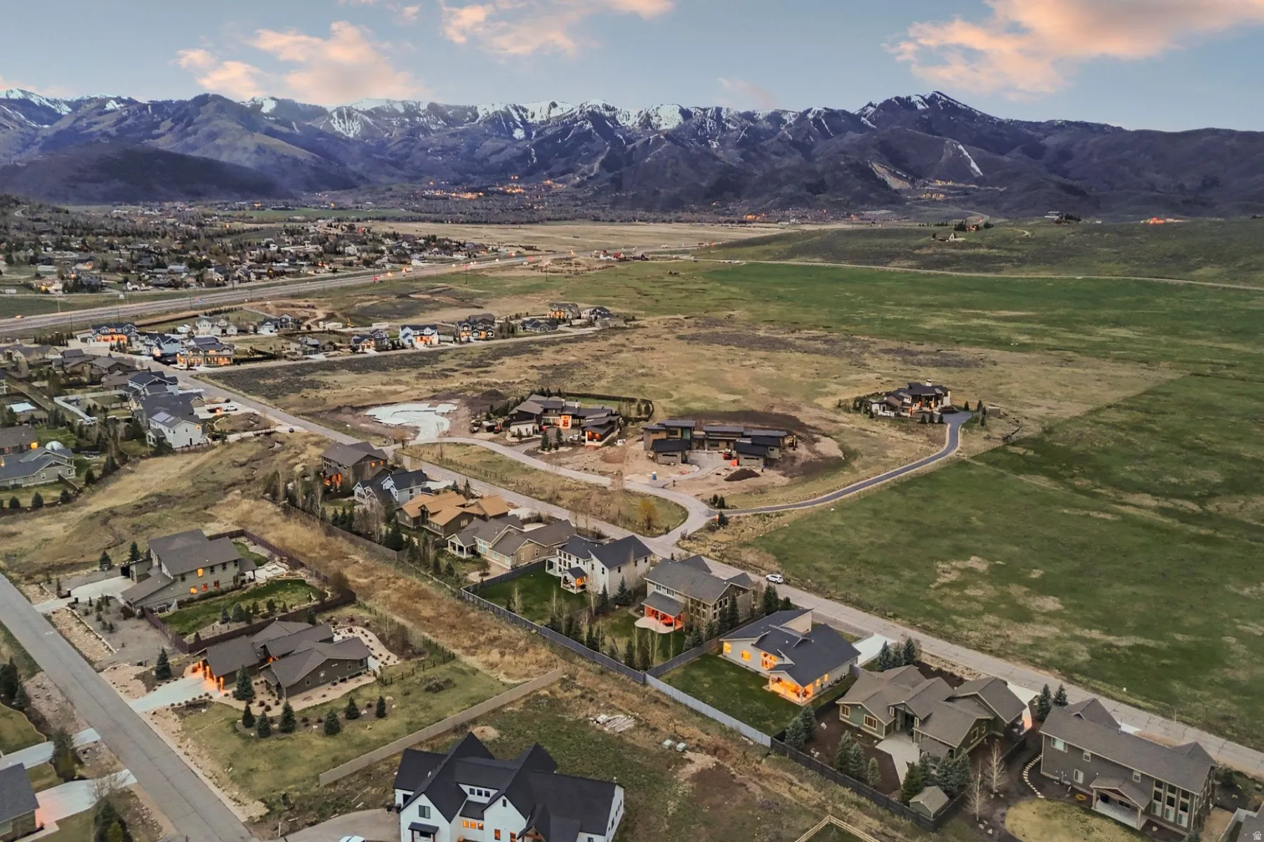 Aerial perspective of suburban area with a mountain backdrop
