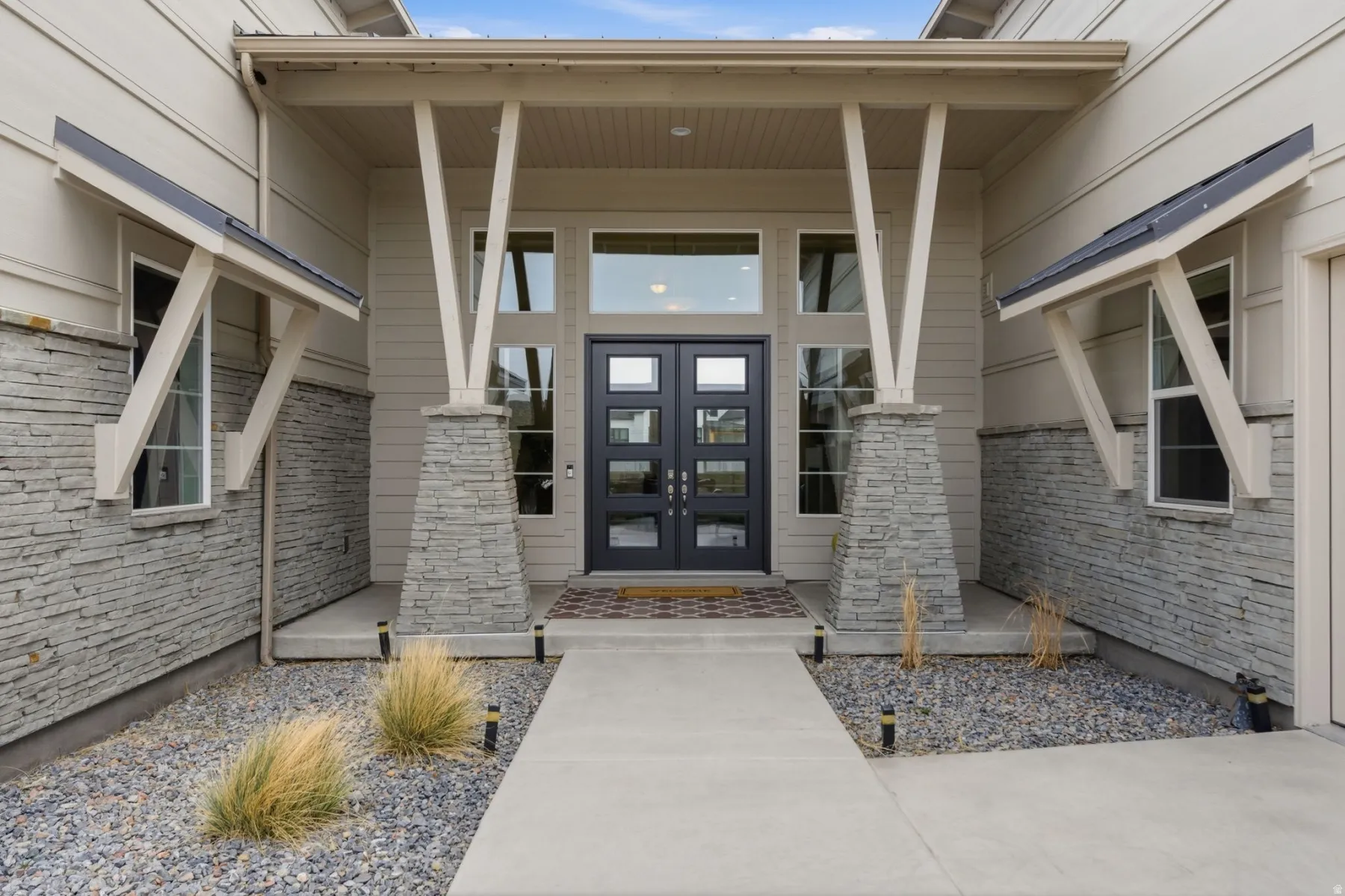 Entrance to property with french doors and covered porch
