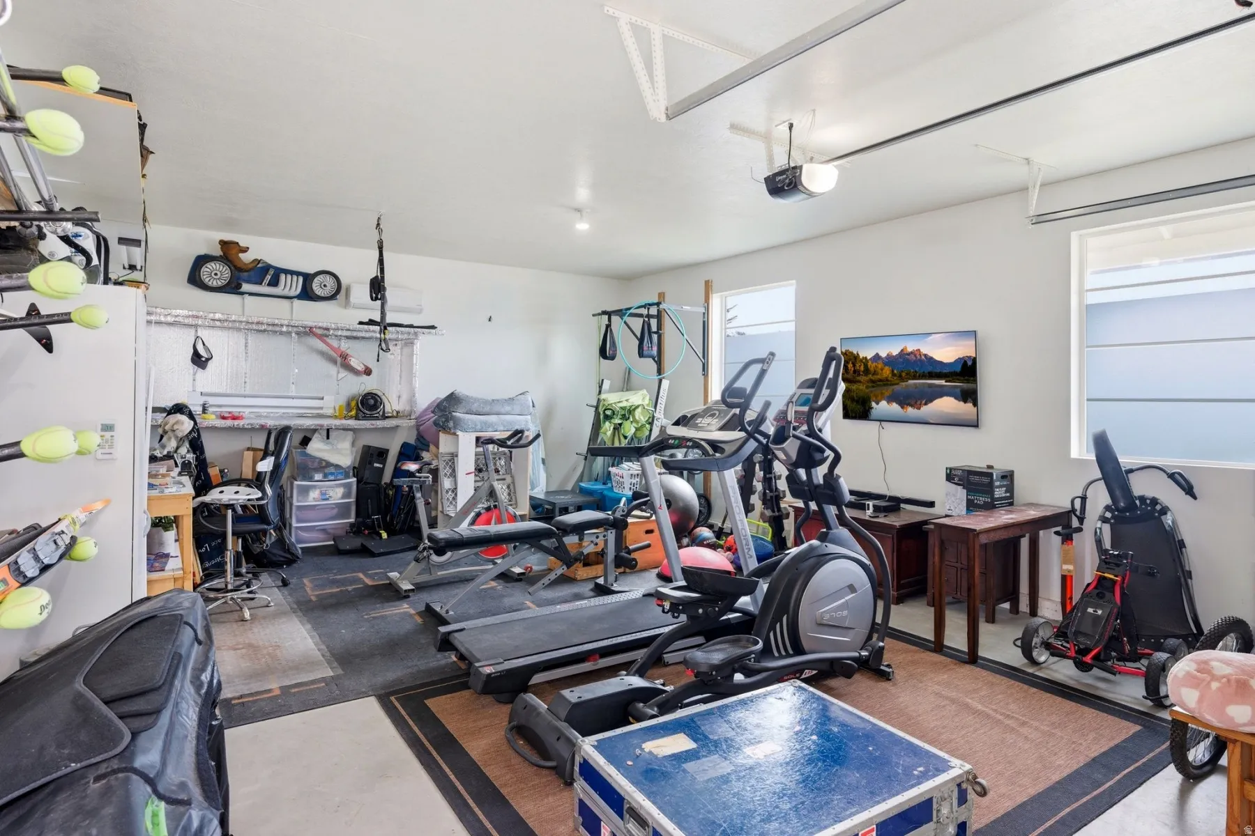 Workout area featuring a garage