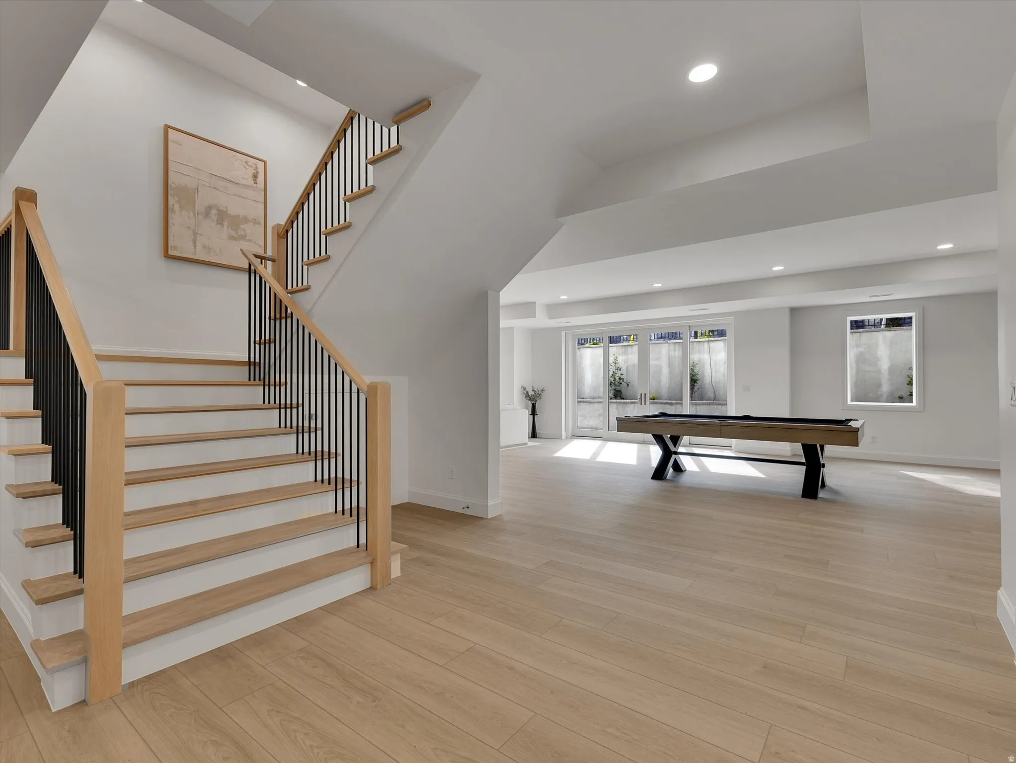 Game room featuring light wood-style floors, recessed lighting, pool table, and french doors