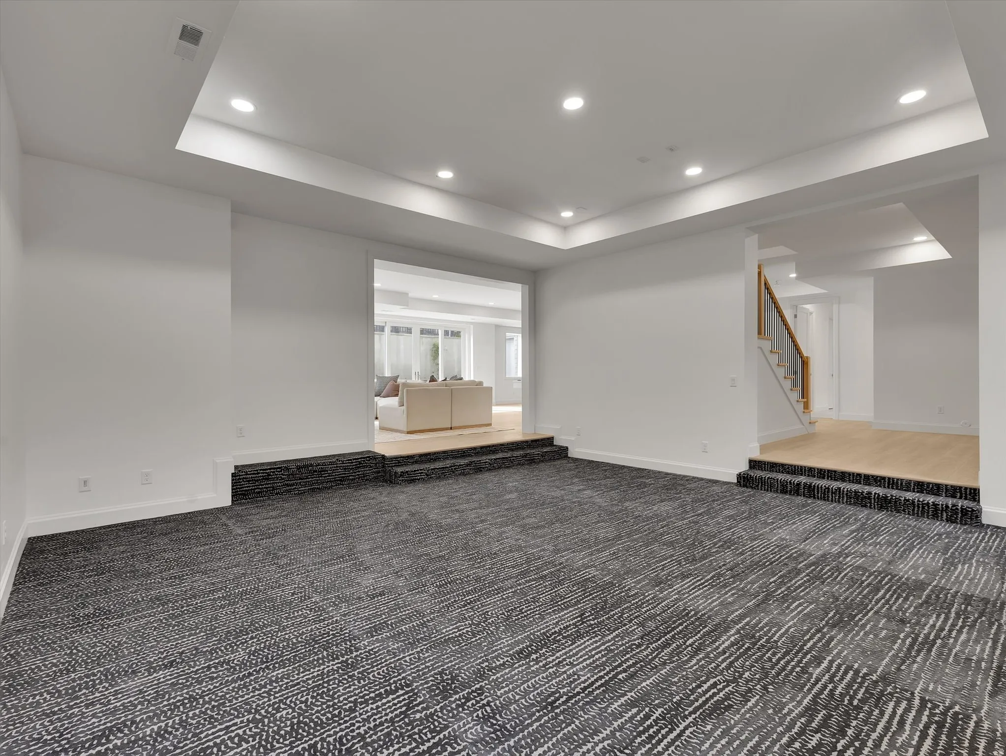 Basement featuring recessed lighting and carpet