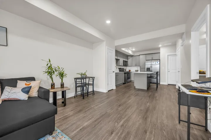 Living area with recessed lighting and dark wood finished floors