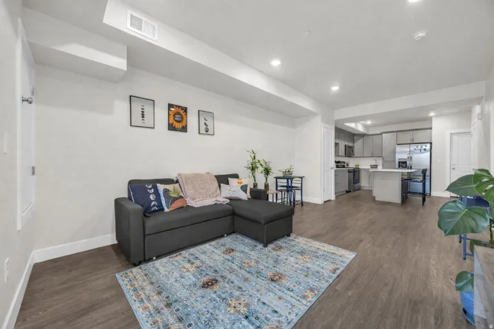 Living area featuring recessed lighting and dark wood finished floors