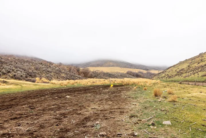 View of mountain background featuring rural landscape