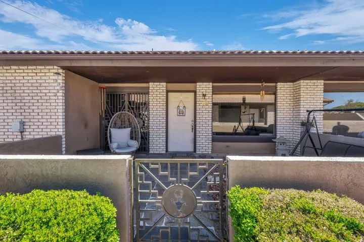 Entrance to property with brick siding