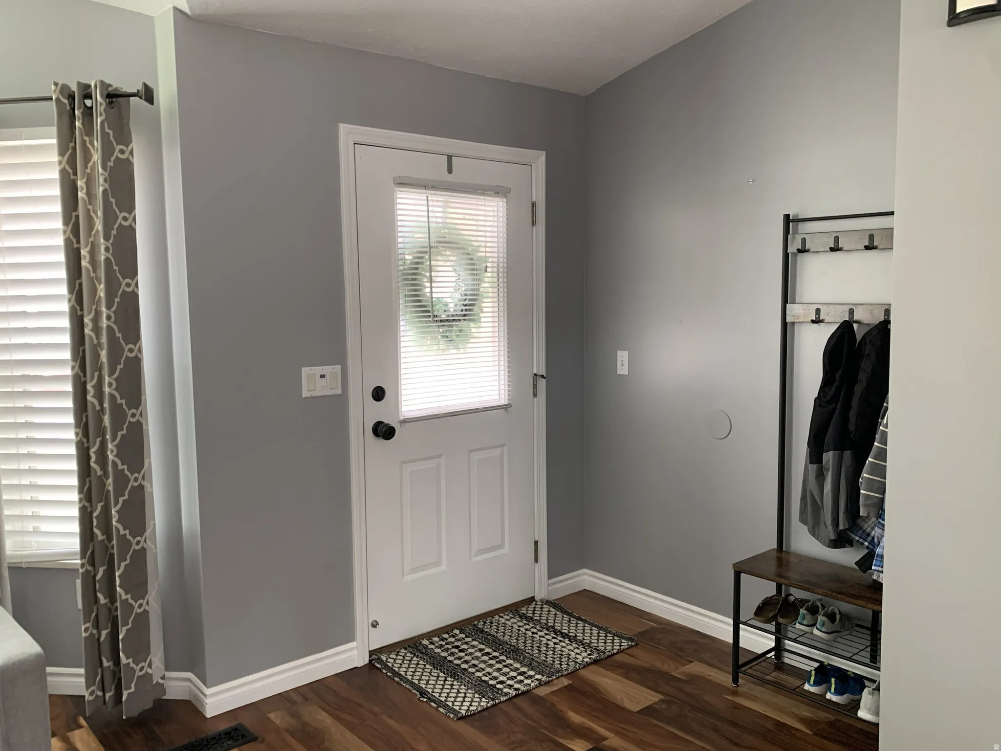 Entrance foyer featuring hardwood floors
