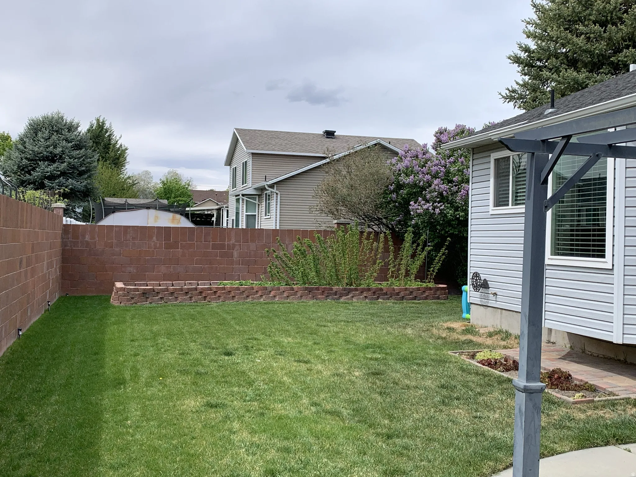 View of fenced backyard