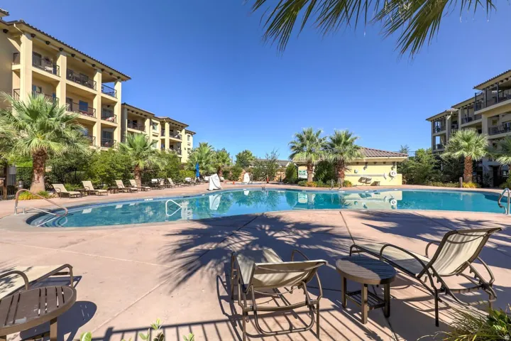 Community pool featuring a patio