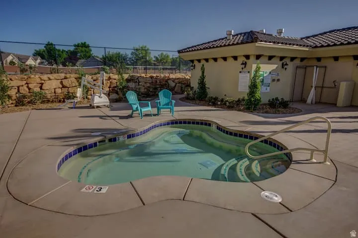 View of swimming pool with a pool and patio surround