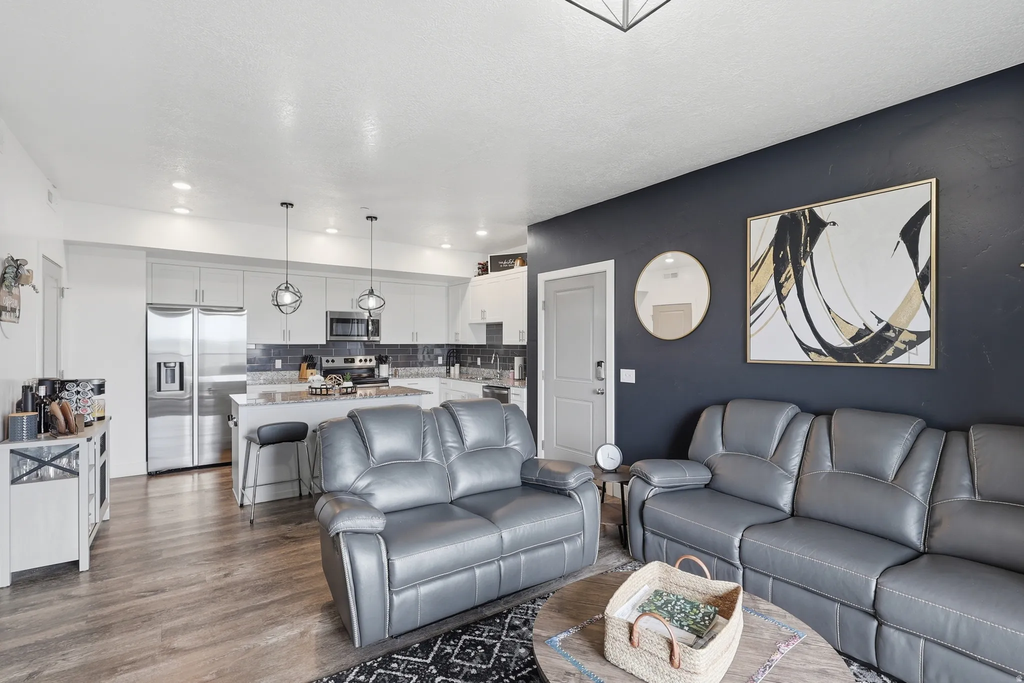 Living area featuring dark wood-style floors