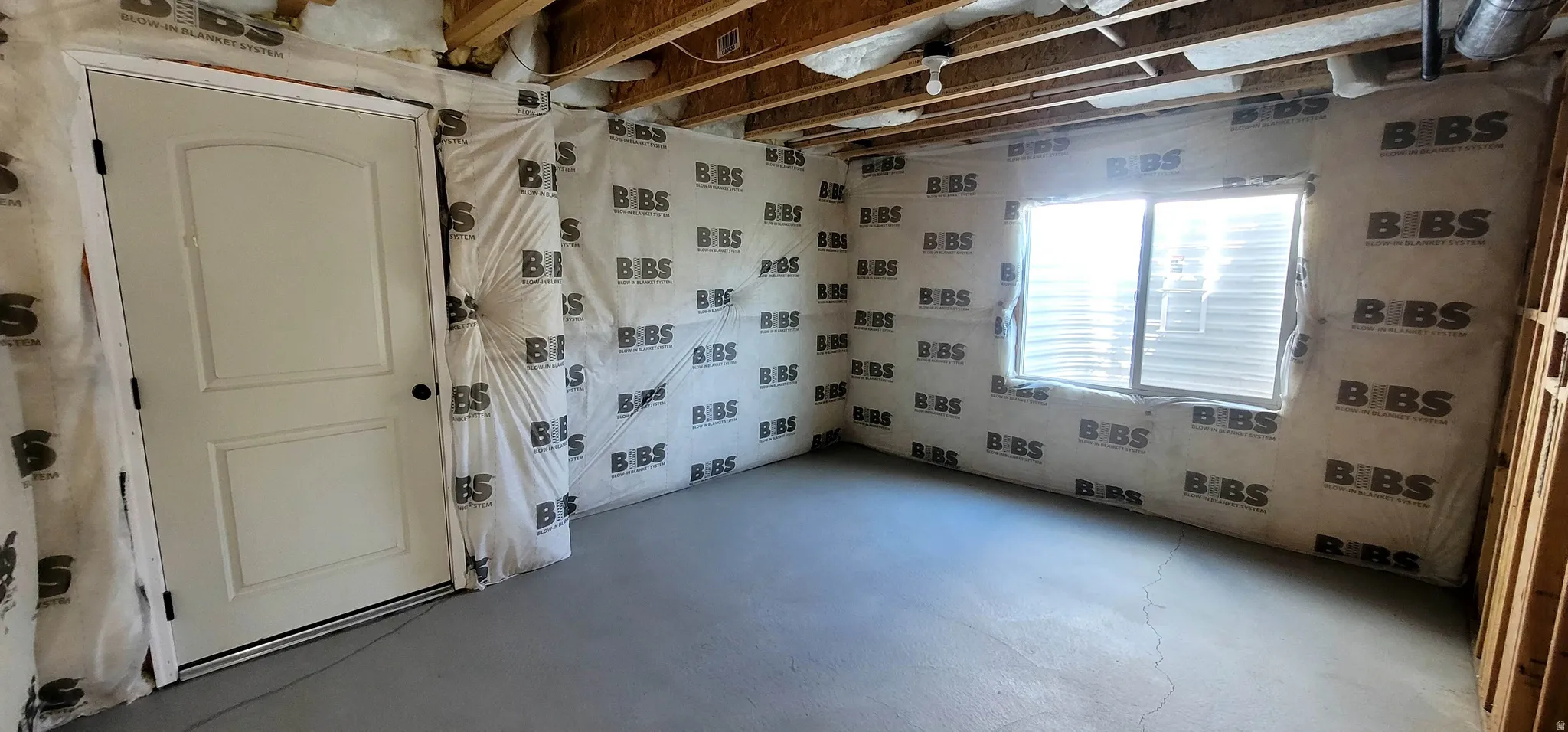 Spare room featuring concrete flooring