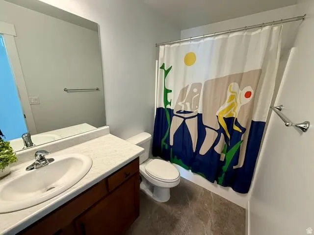 Full bath featuring vanity and a shower with curtain