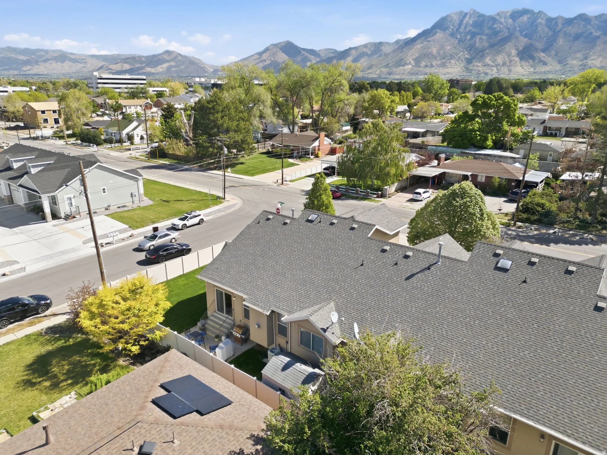 Aerial perspective of suburban area featuring a mountainous background