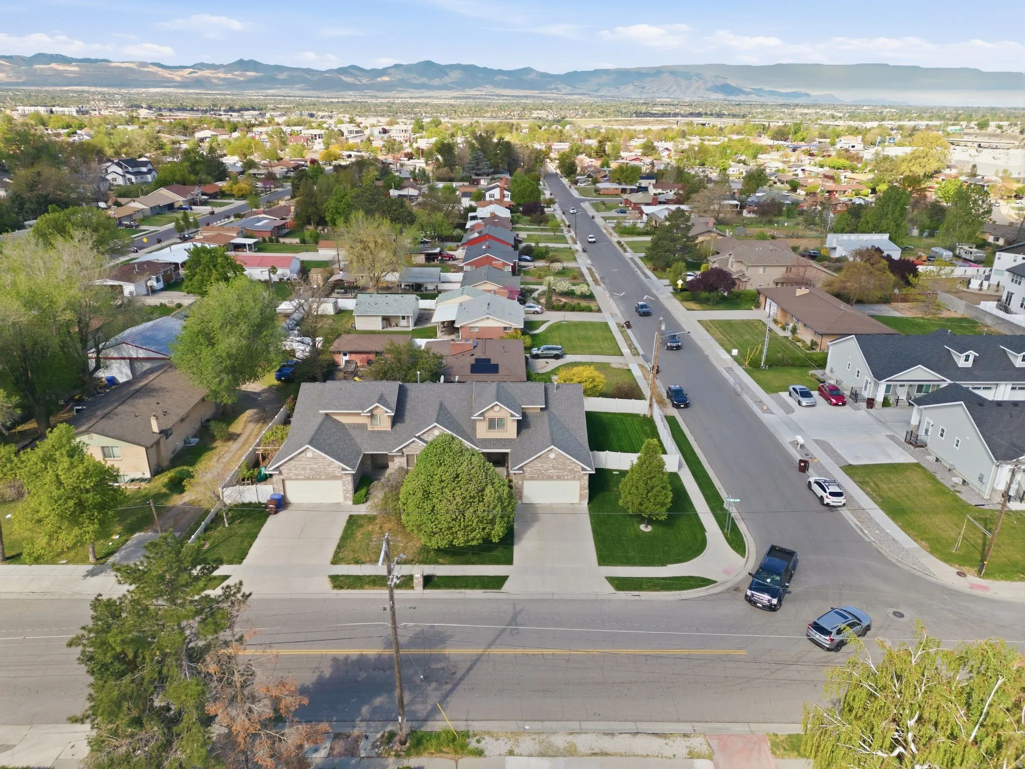 Aerial view of residential area with a mountainous background
