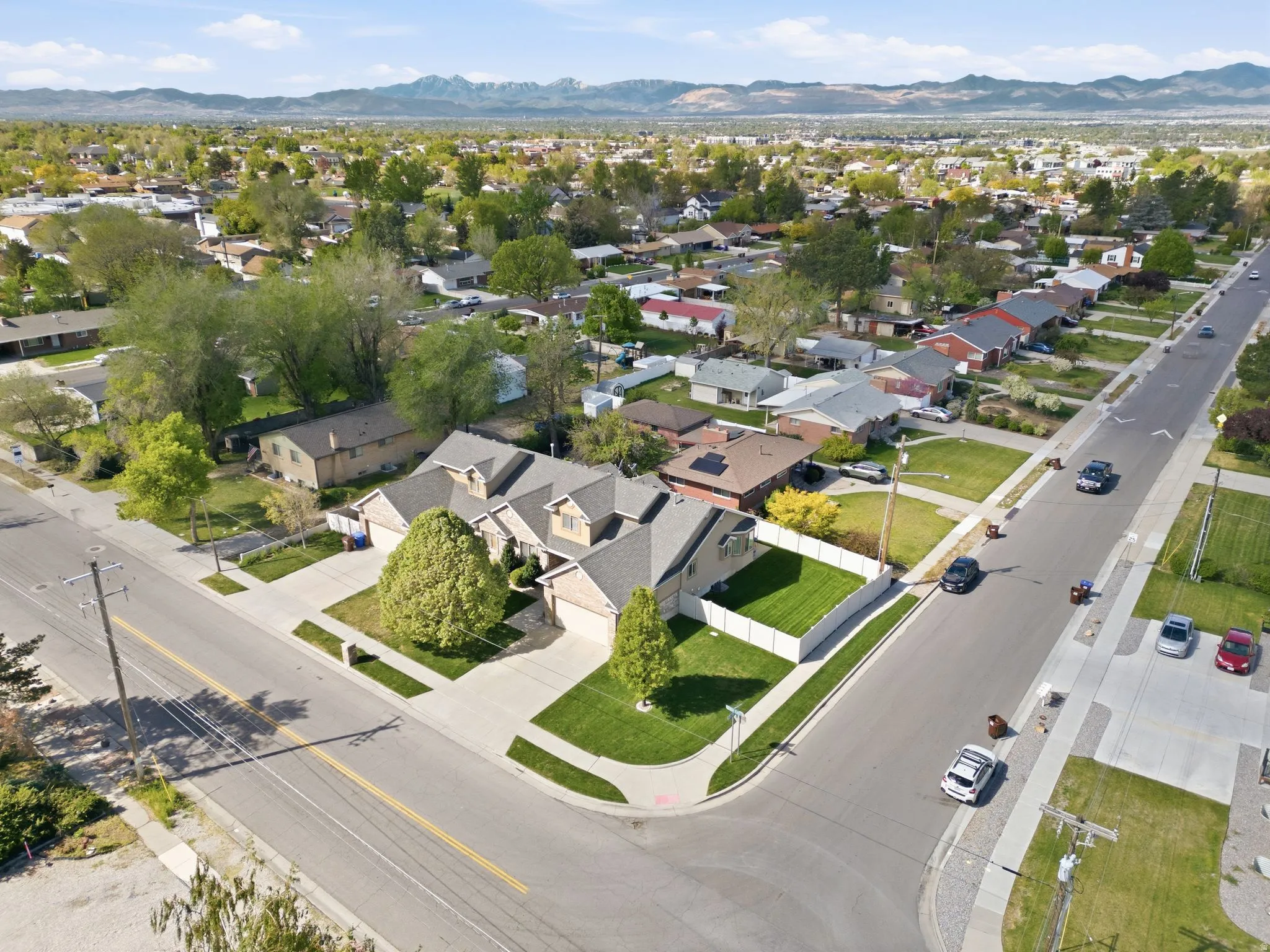 Aerial perspective of suburban area with a mountainous background