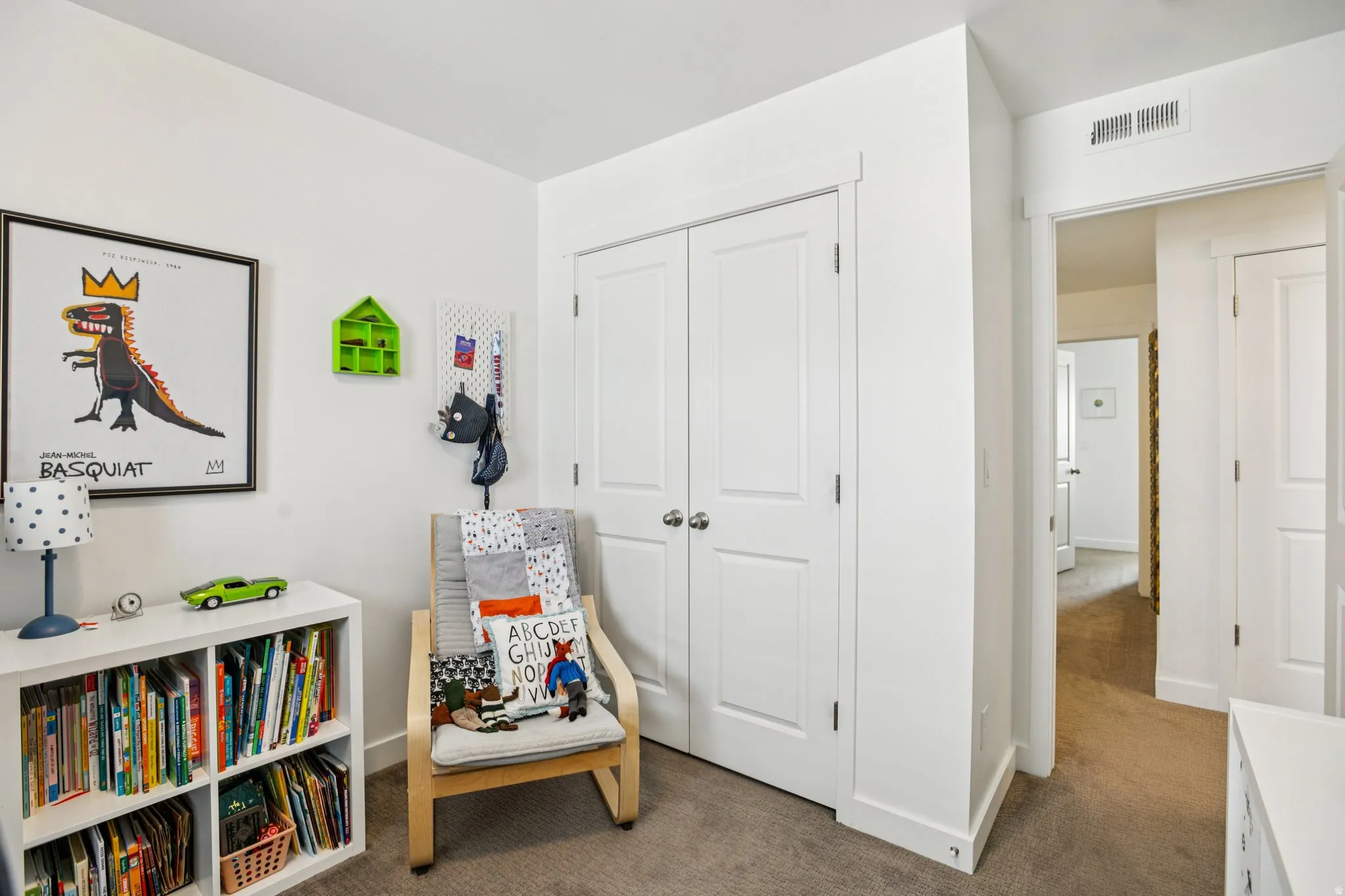 Game room with dark colored carpet and baseboards