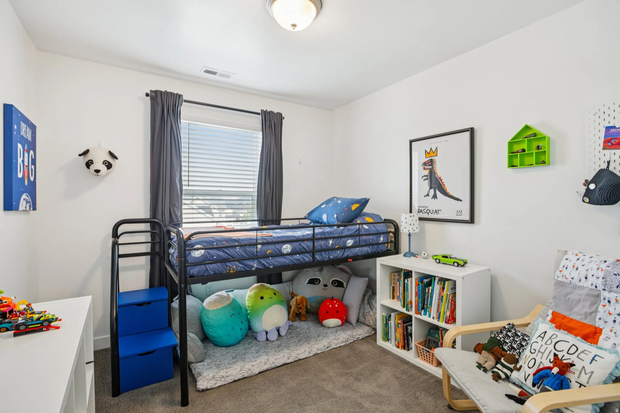 Bedroom with dark colored carpet