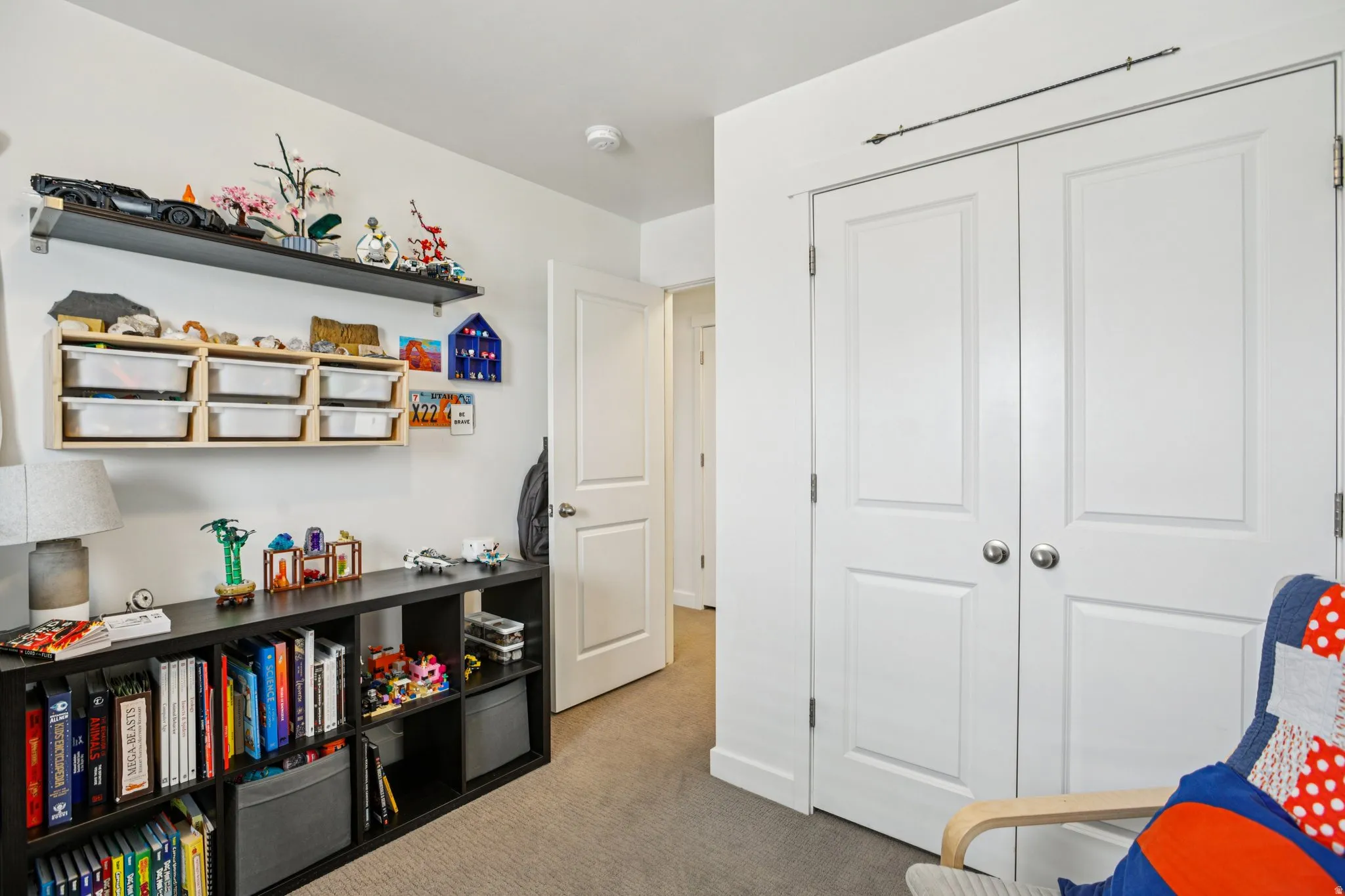 Sitting room featuring light colored carpet