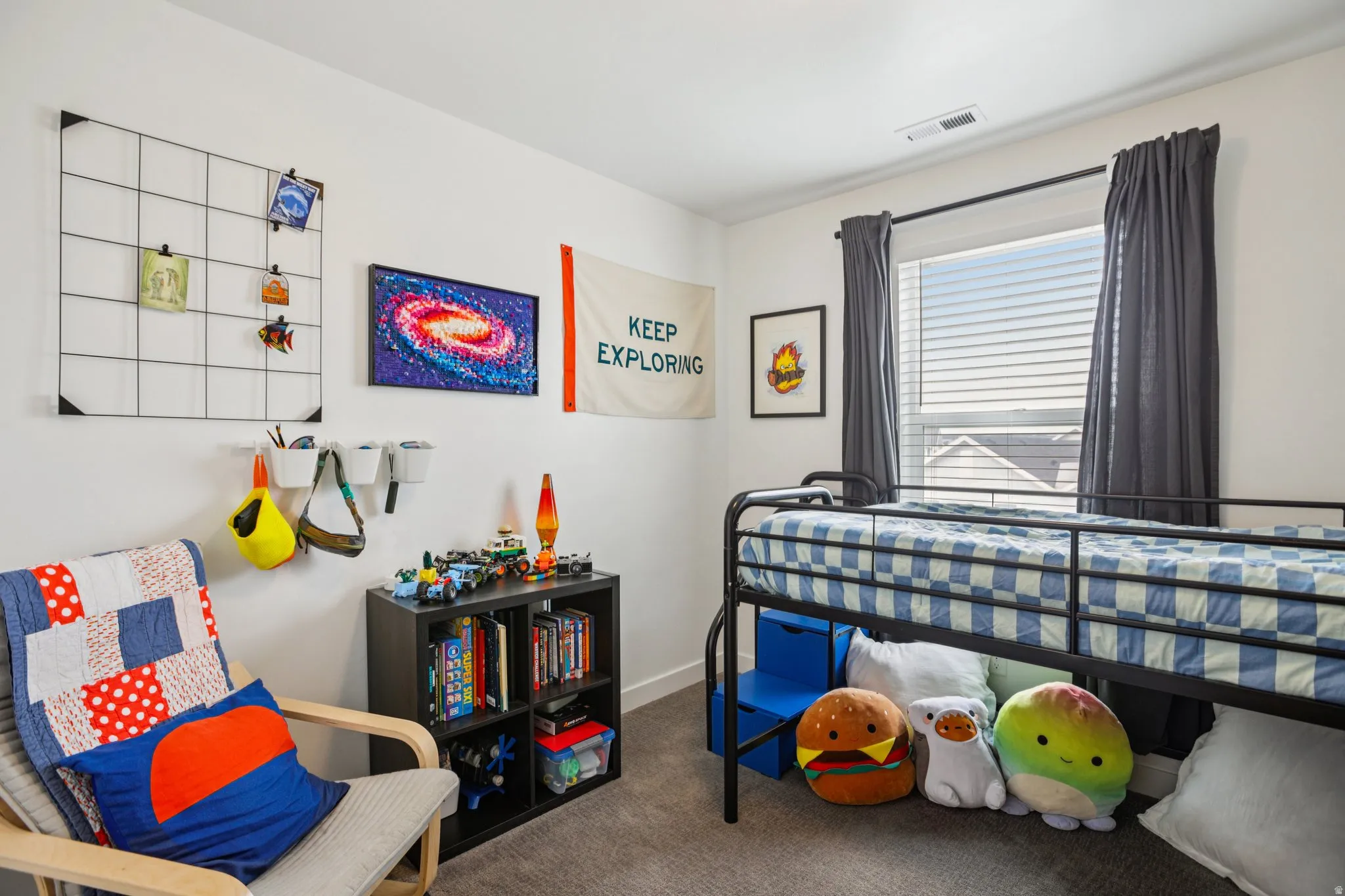 Bedroom featuring carpet and baseboards