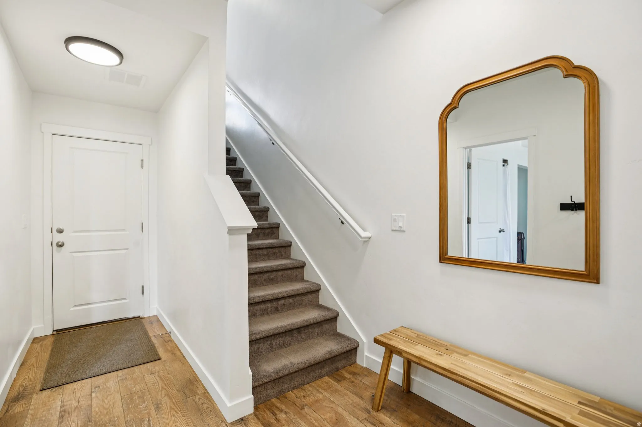 Entrance foyer featuring light wood-style flooring