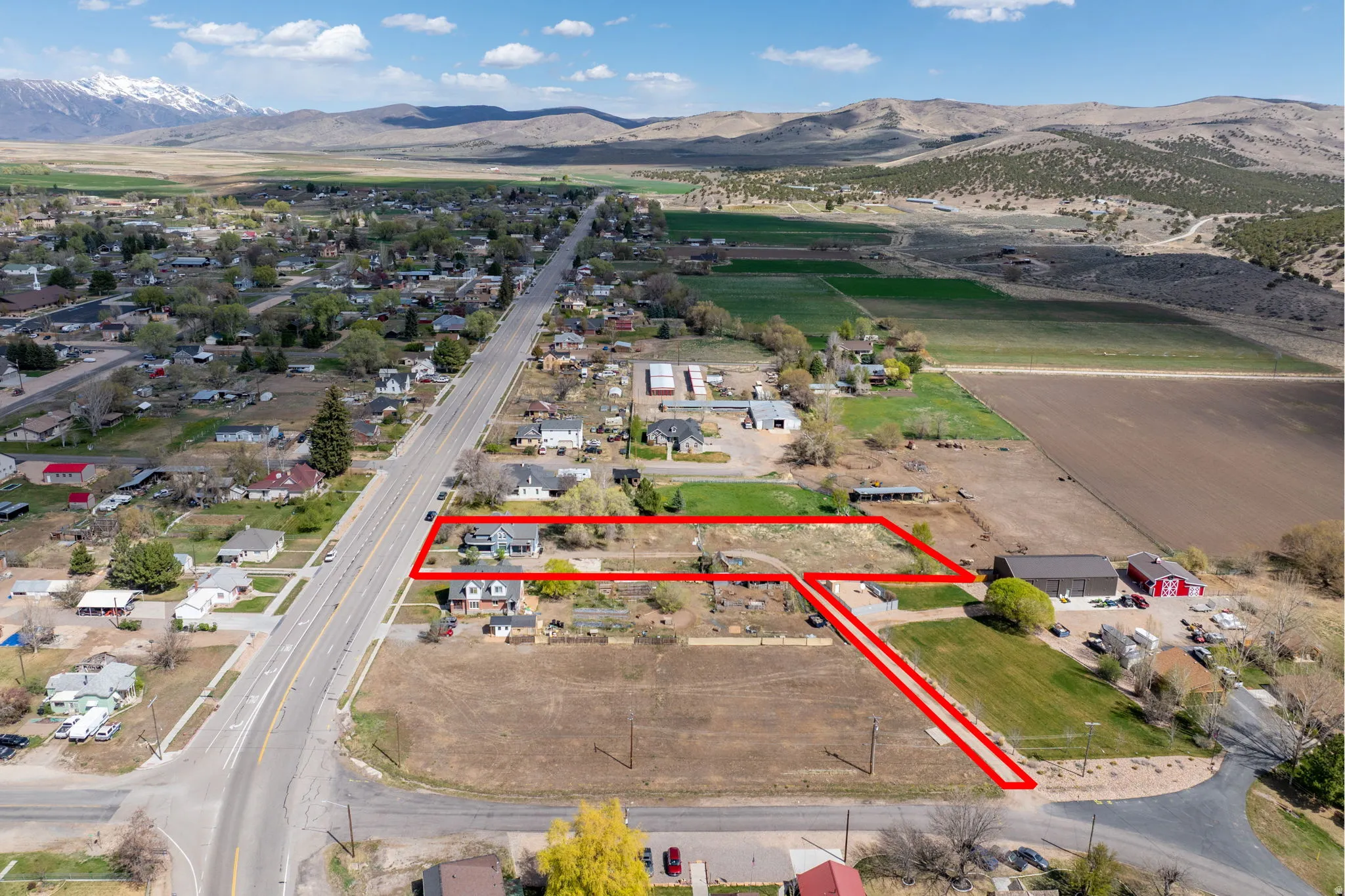 View of rural area with property boundaries highlighted and a mountain backdrop
