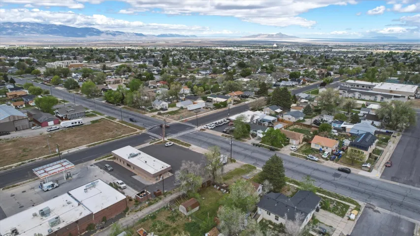 Aerial perspective showcasing a residential neighborhood with distant mountains