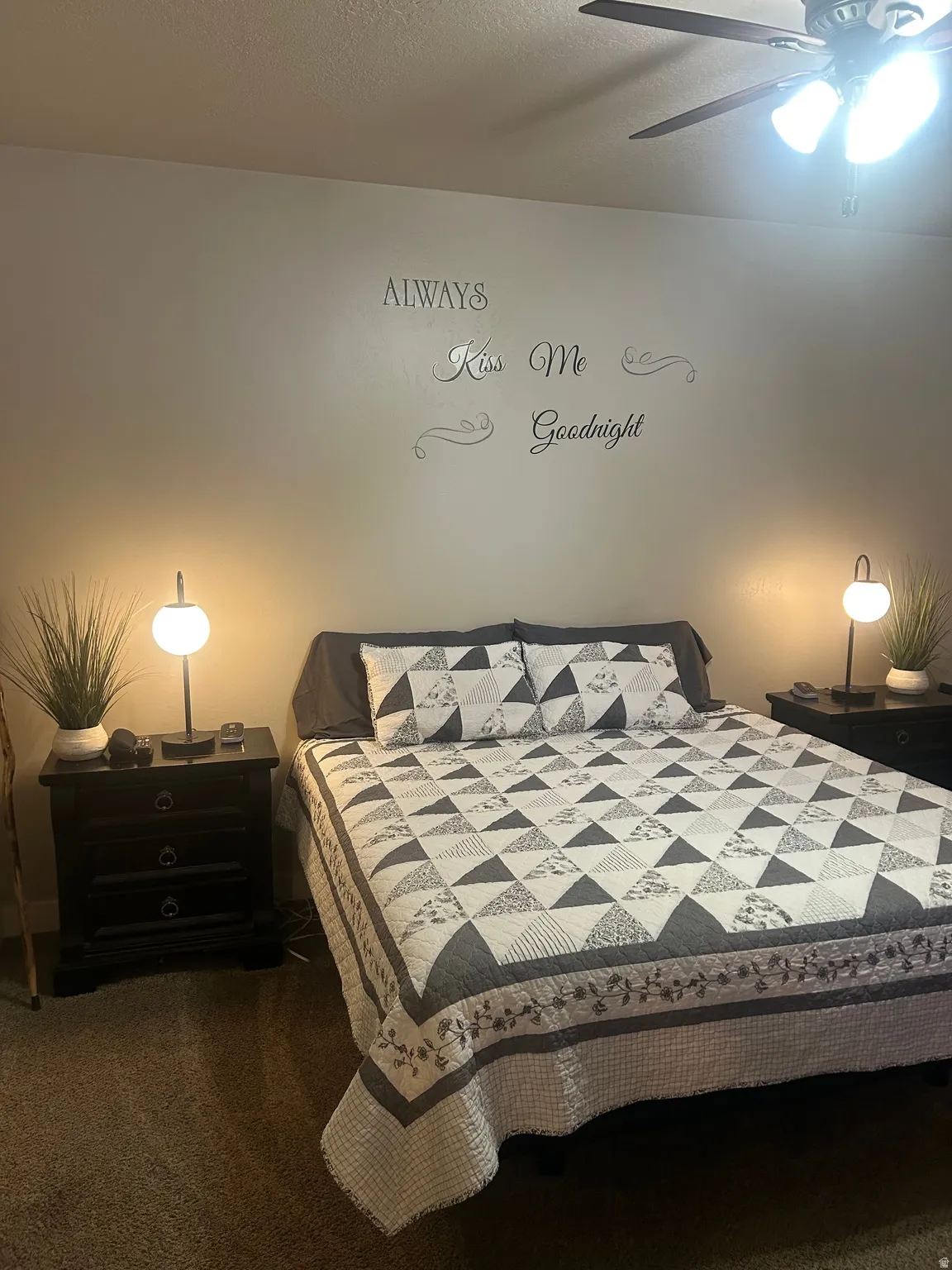 Bedroom with a ceiling fan and carpet flooring