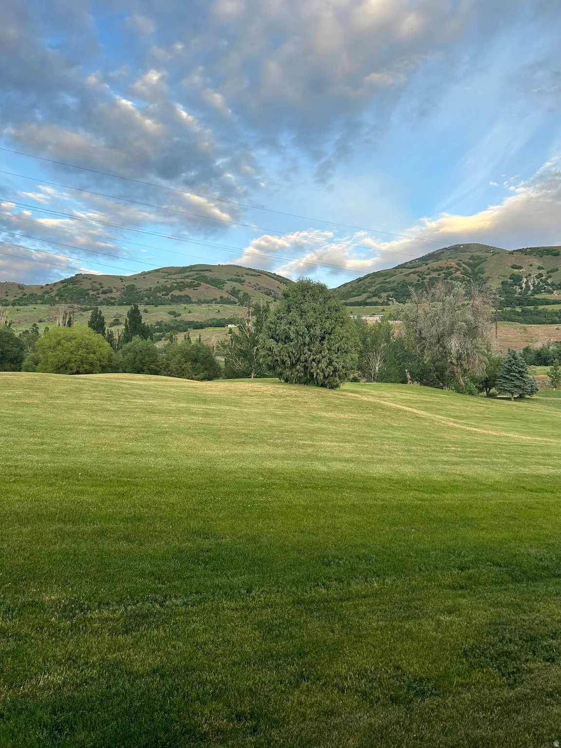 View of mountain background featuring rural landscape