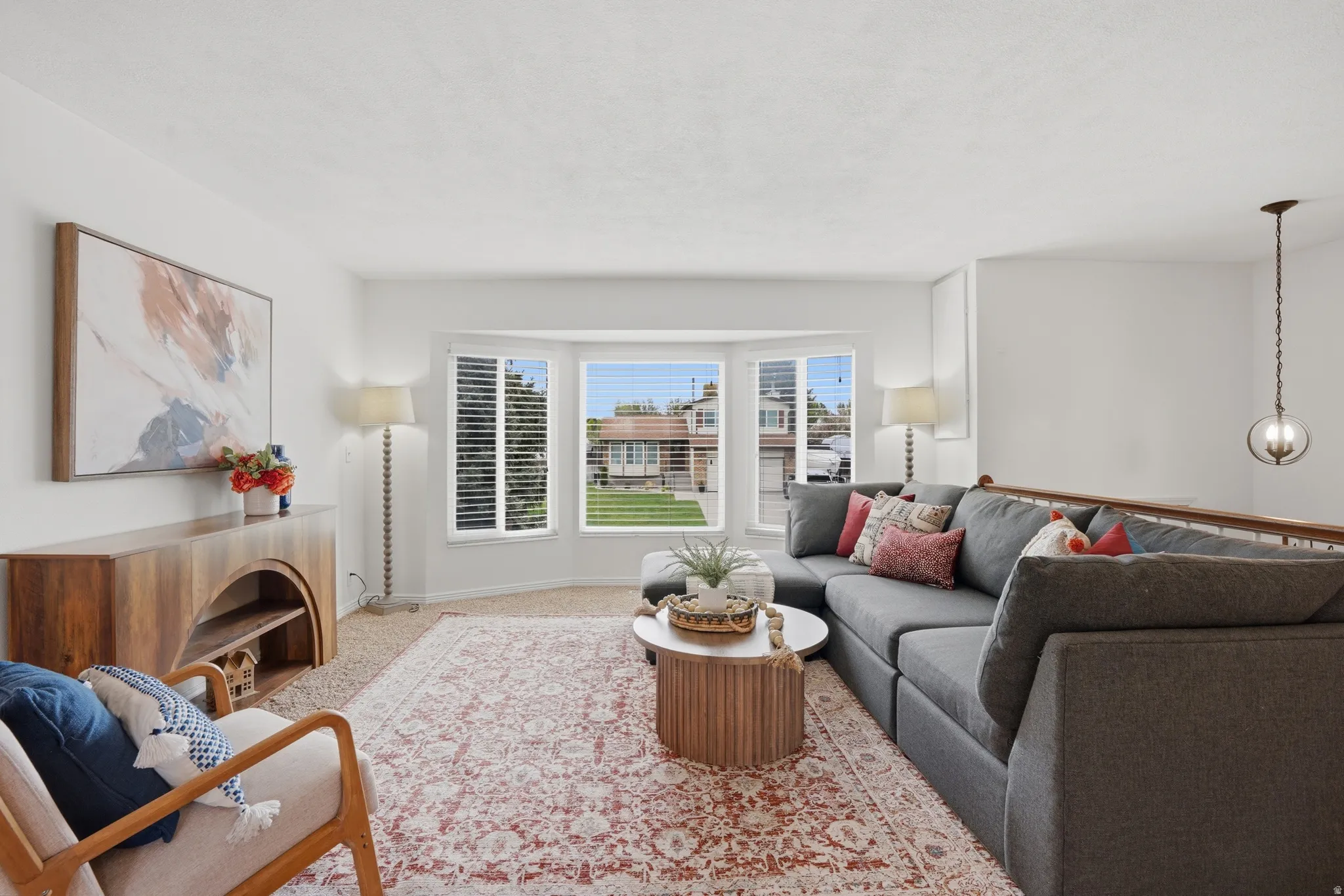 Living area with carpet floors and baseboards