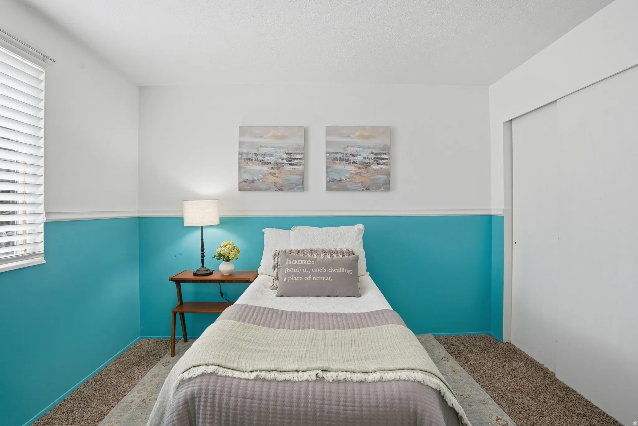 Bedroom featuring carpet floors and a closet