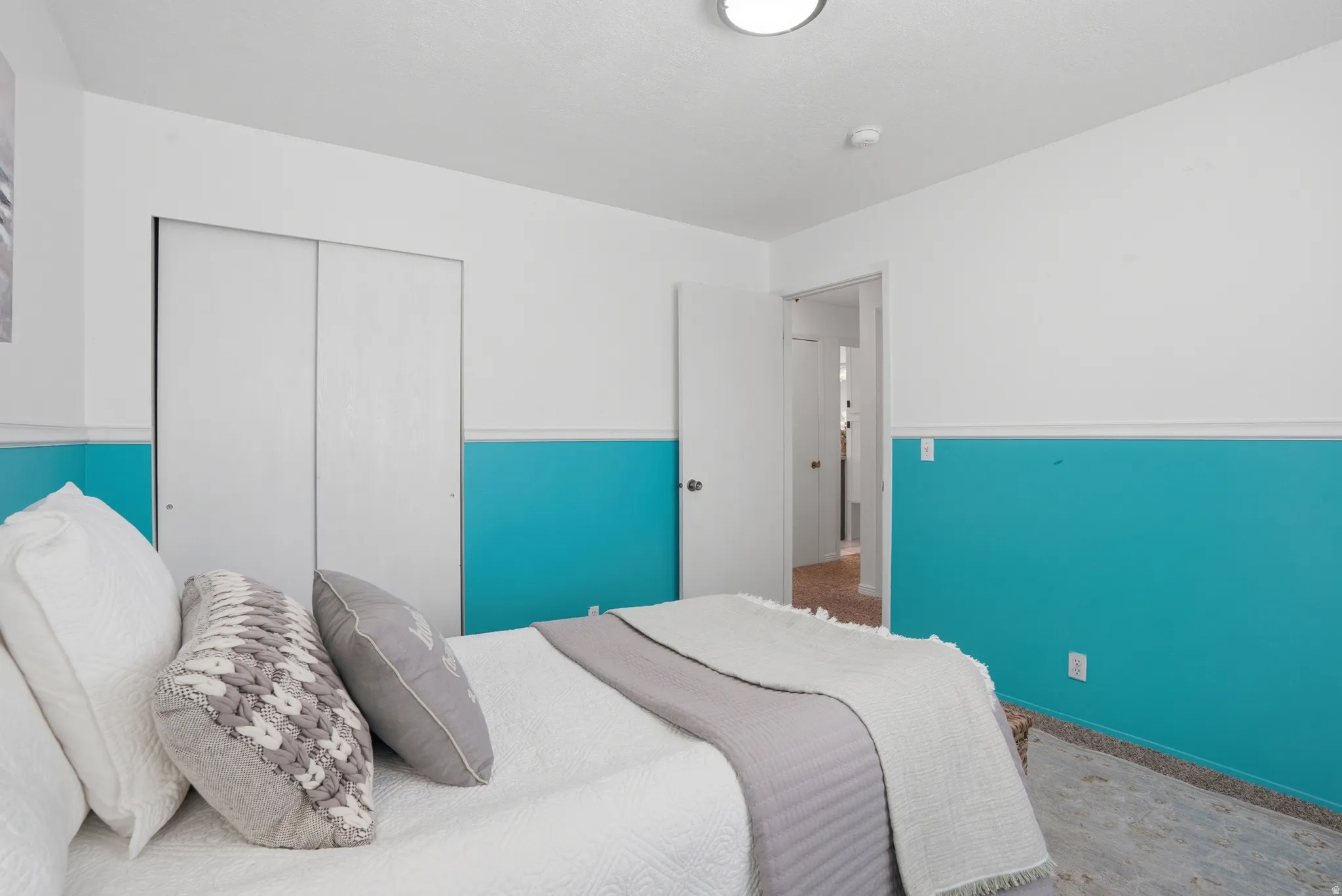 Bedroom with a closet and baseboards
