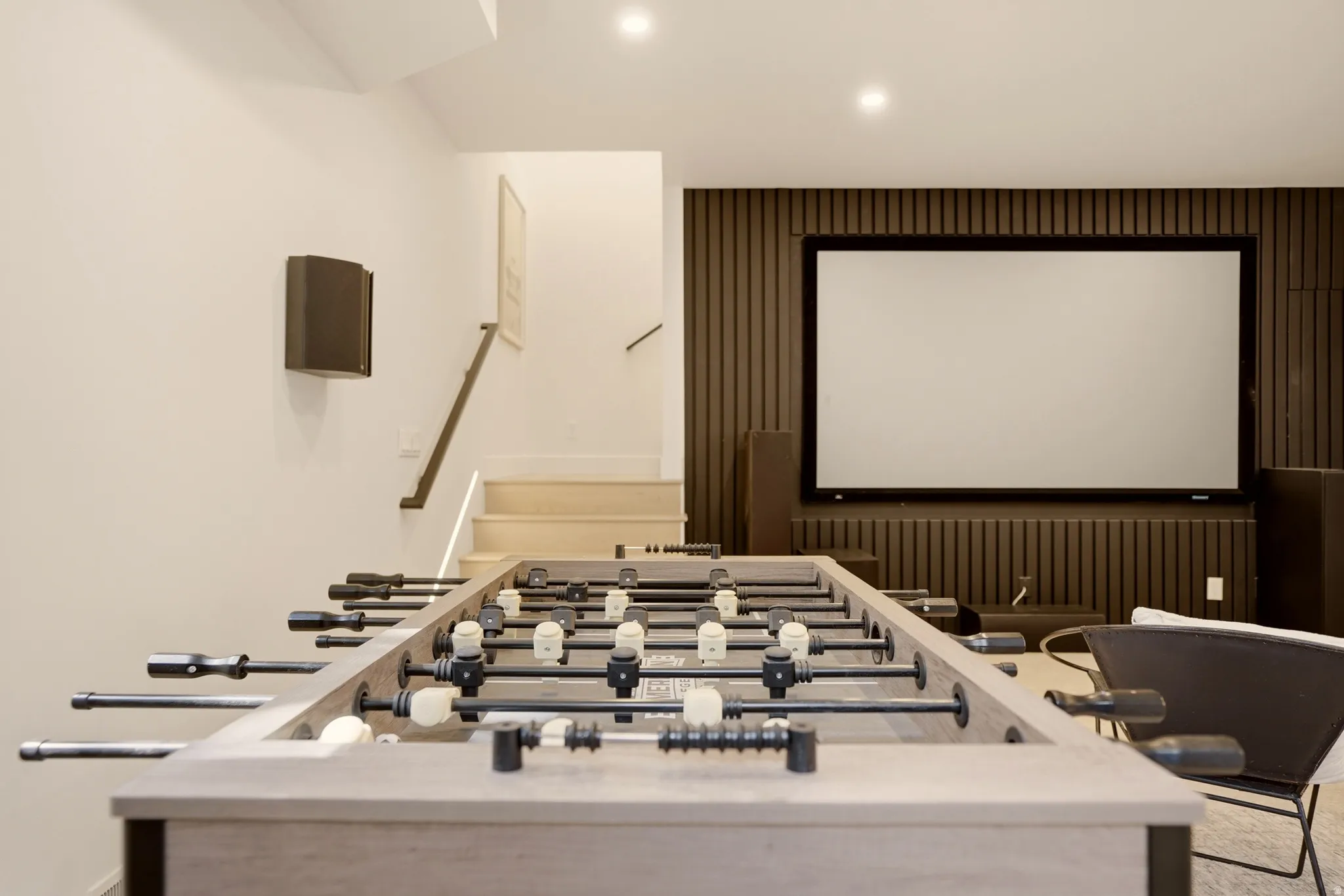 MOVIE ROOM WITH GAMING TABLE ADJACENT HOME GYM