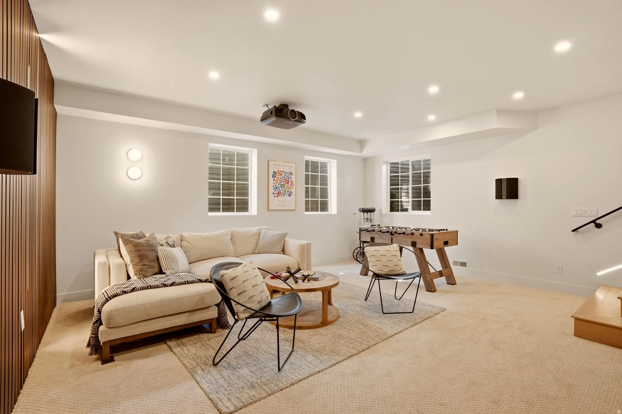 LOWER LEVEL MOVIE ROOM ADJACENT TO HOME GYM AND SMALL SAFE ROOM