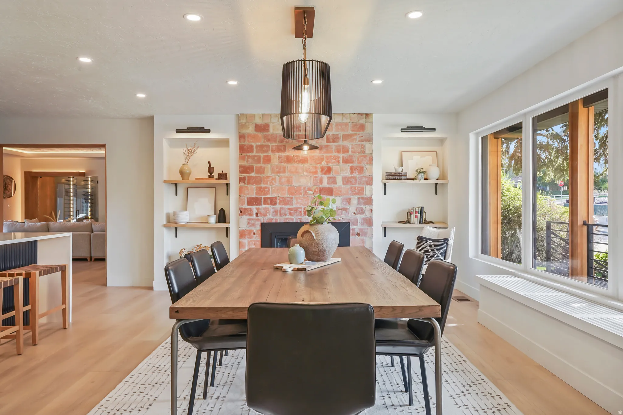 DINING AREA WITH EXPOSED ORIGINAL BRICK AND KITCHEN WITH BUTLER PANTRY