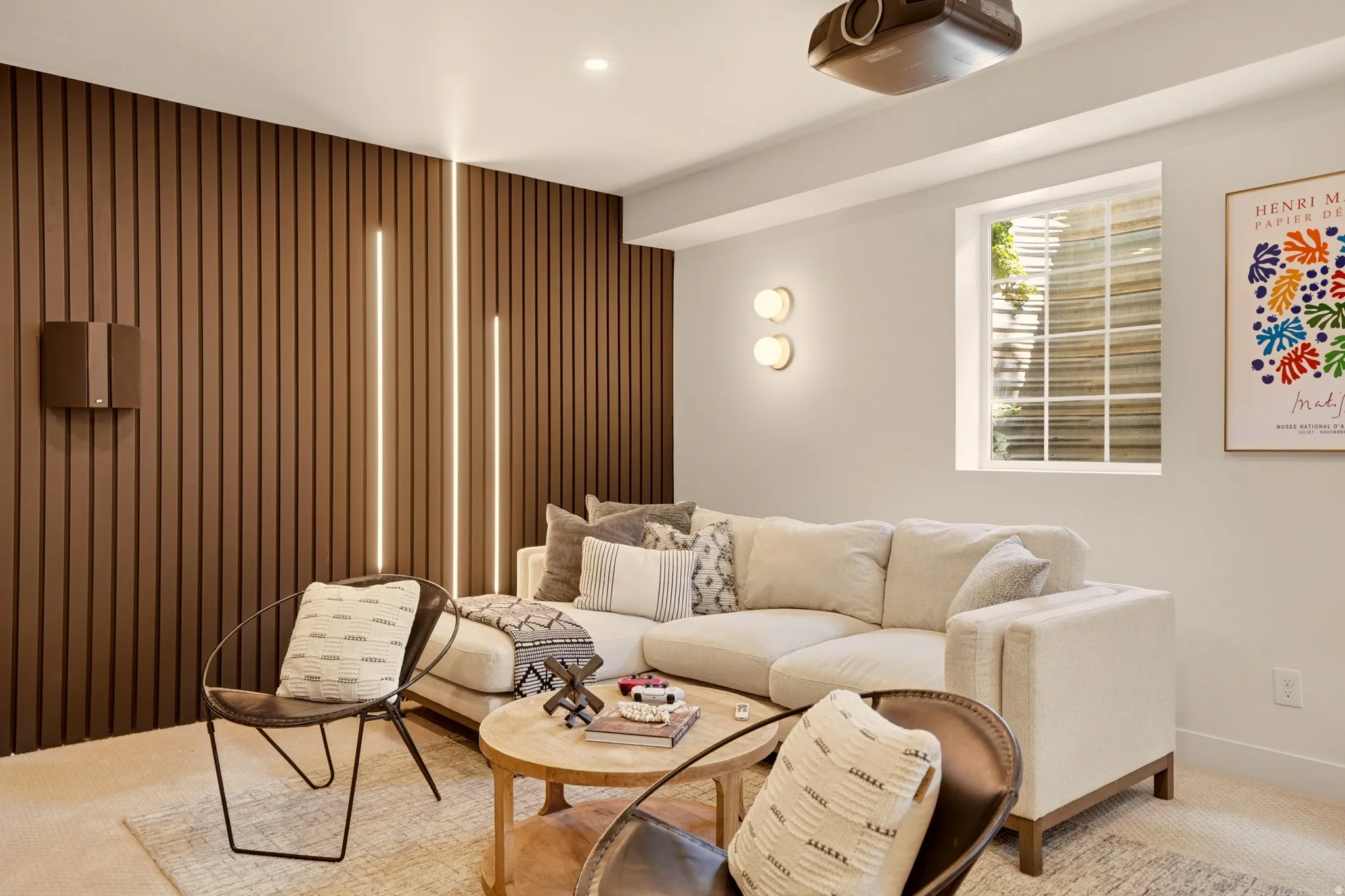 LOWER LEVEL MOVIE ROOM ADJACENT TO HOME GYM AND SMALL SAFE ROOM