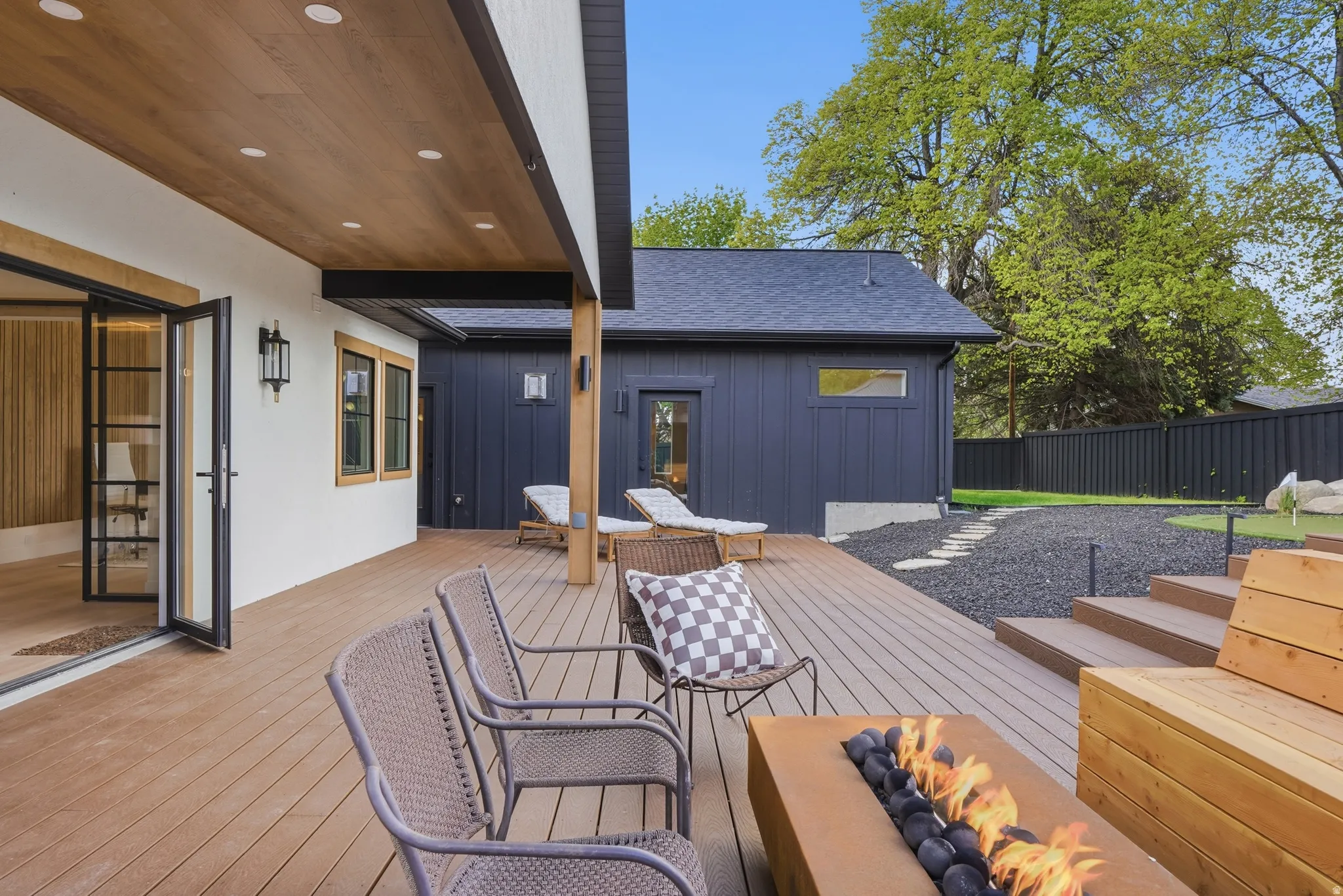 Wooden terrace with a fire pit