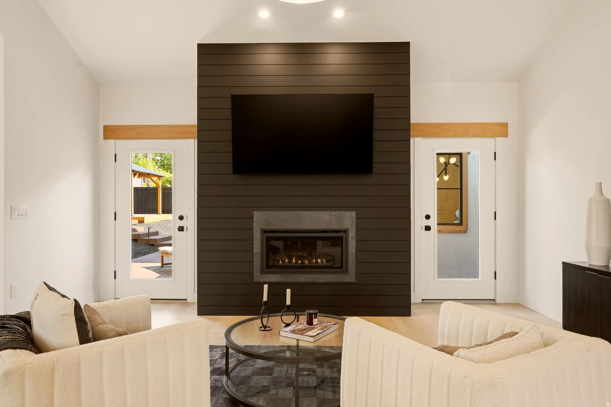MAIN FLOOR PRIMARY BEDROOM SUITE WITH GAS FIREPLACE AND OPENS ONTO BACK YARD