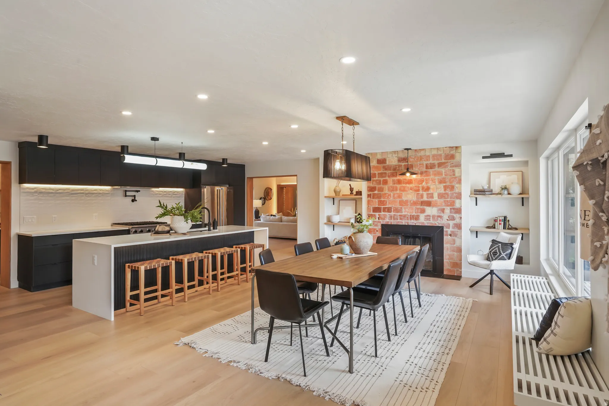 DINING AREA WITH EXPOSED ORIGINAL BRICK AND KITCHEN WITH BUTLER PANTRY