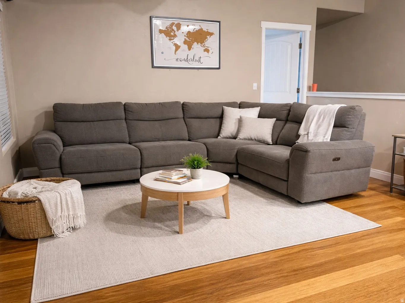 Living area with baseboards and wood finished floors