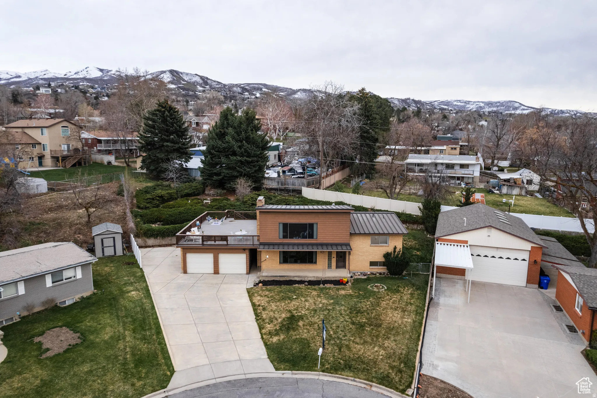 Aerial perspective of suburban area with a mountain backdrop