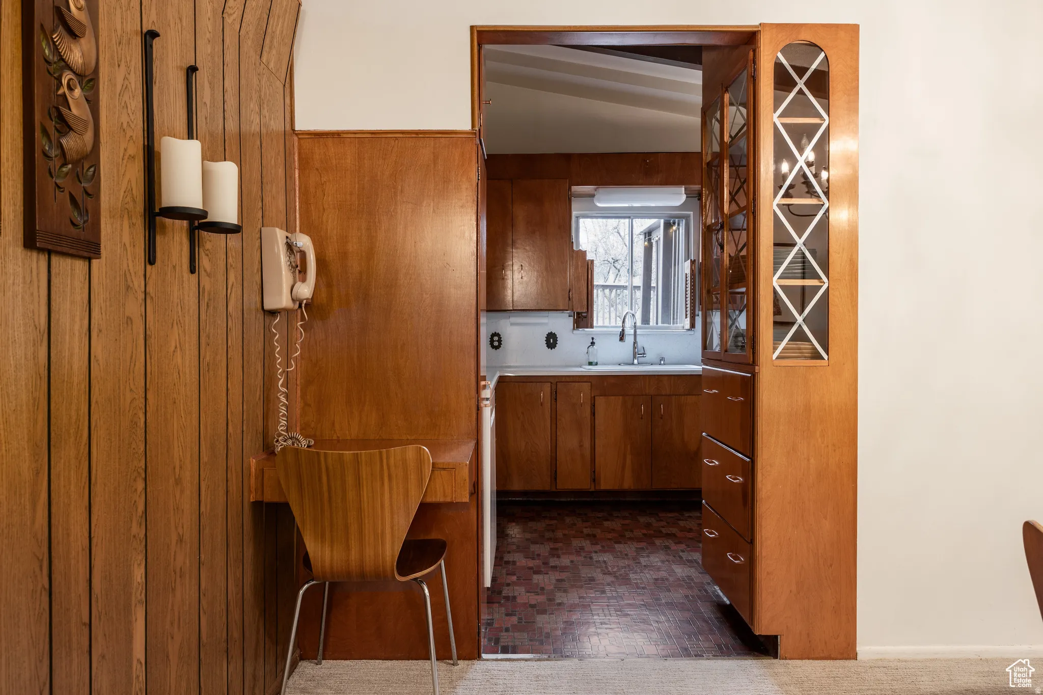 Kitchen with light countertops and wood finish cabinetry