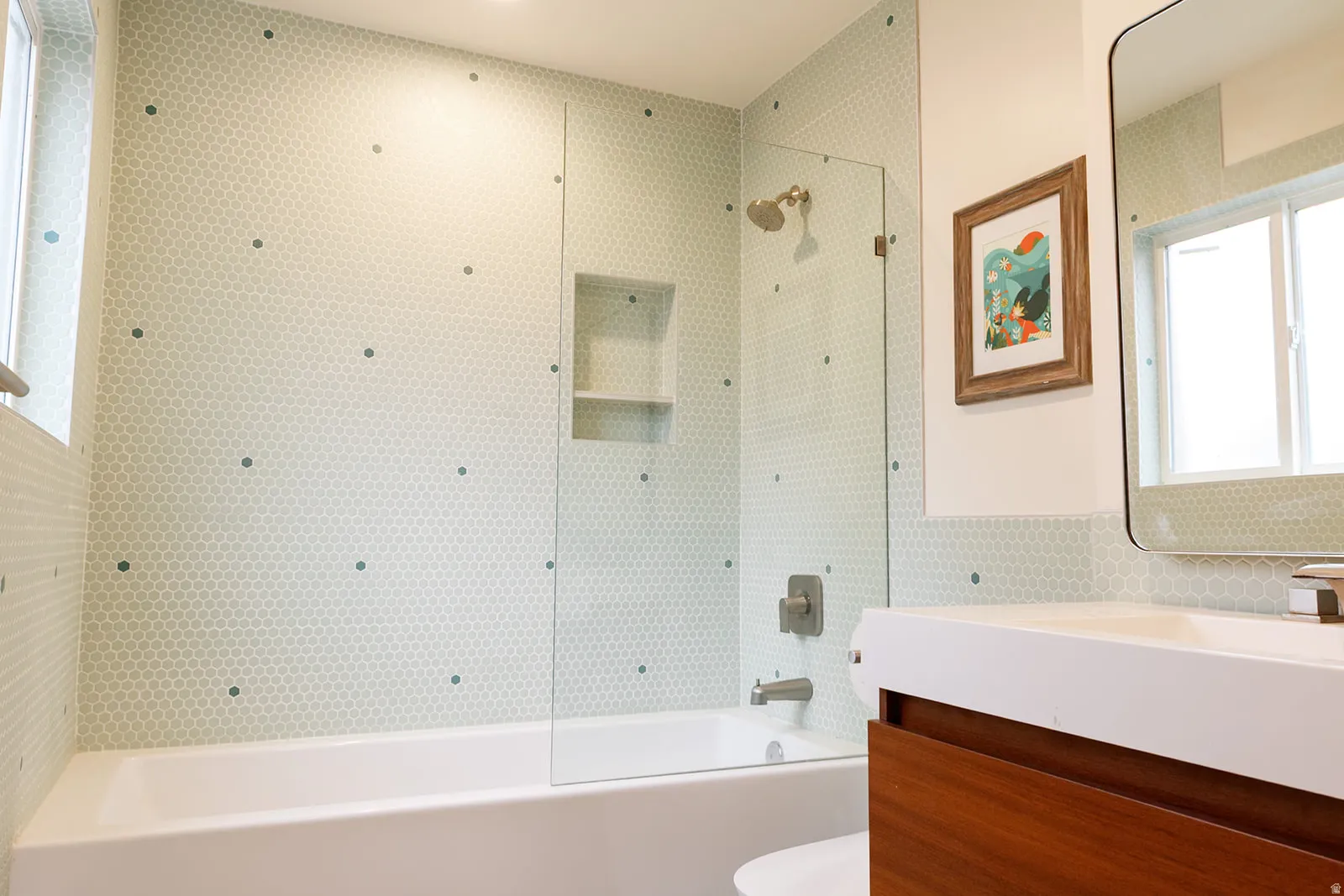 Bathroom featuring vanity and bathing tub / shower combination